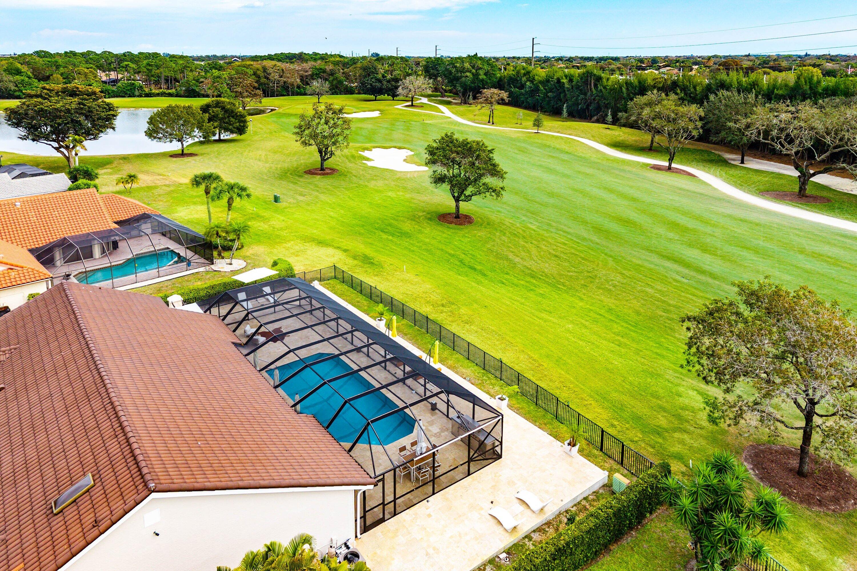 10710 Boca Woods Lane Boca Raton, FL 33428 - Photo 24 of 44 a view of an outdoor space and swimming pool