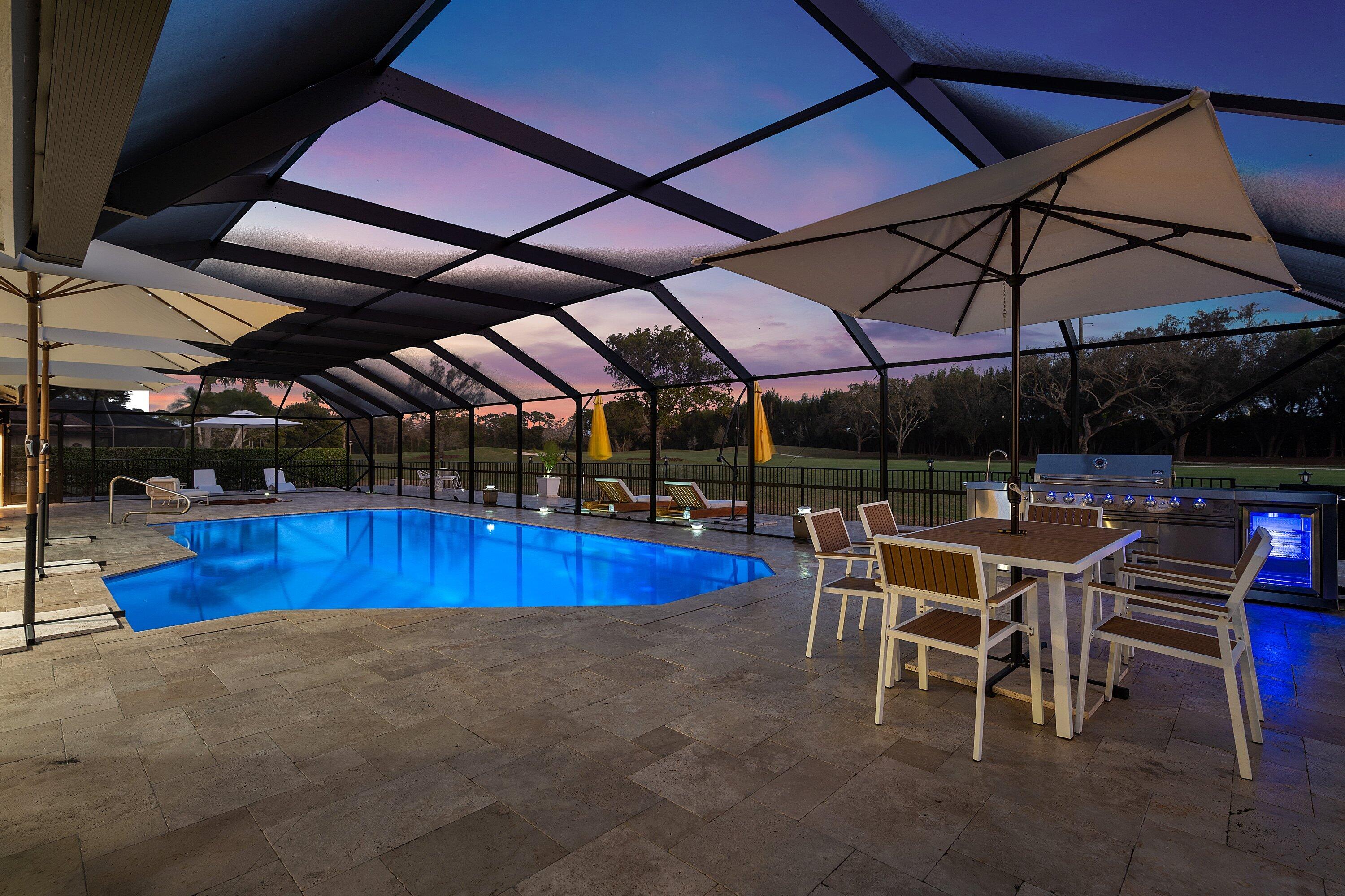 10710 Boca Woods Lane Boca Raton, FL 33428 - Photo 28 of 44 a view of a big swimming pool with sitting area