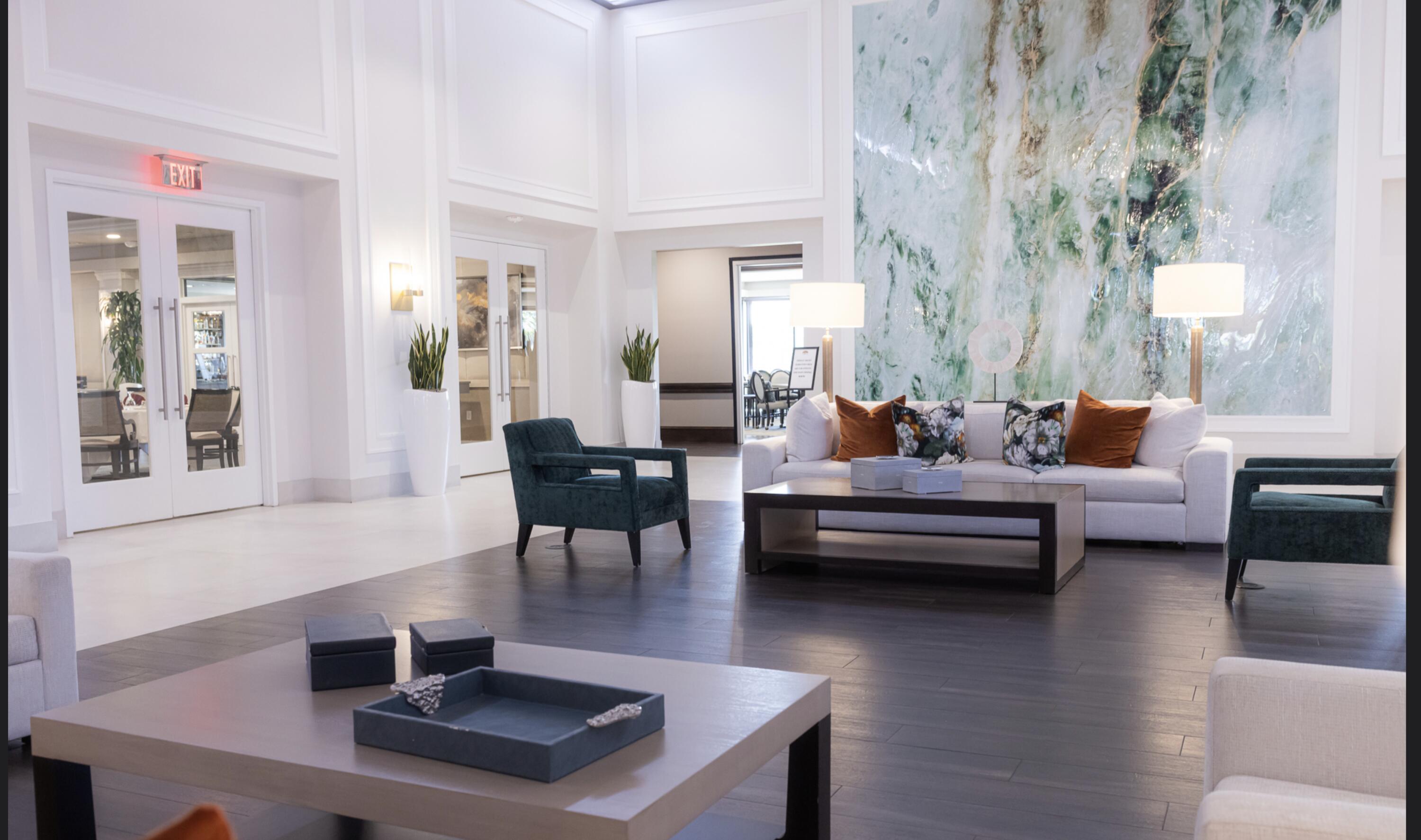 10710 Boca Woods Lane Boca Raton, FL 33428 - Photo 38 of 44 a living room with furniture wooden floor and a table