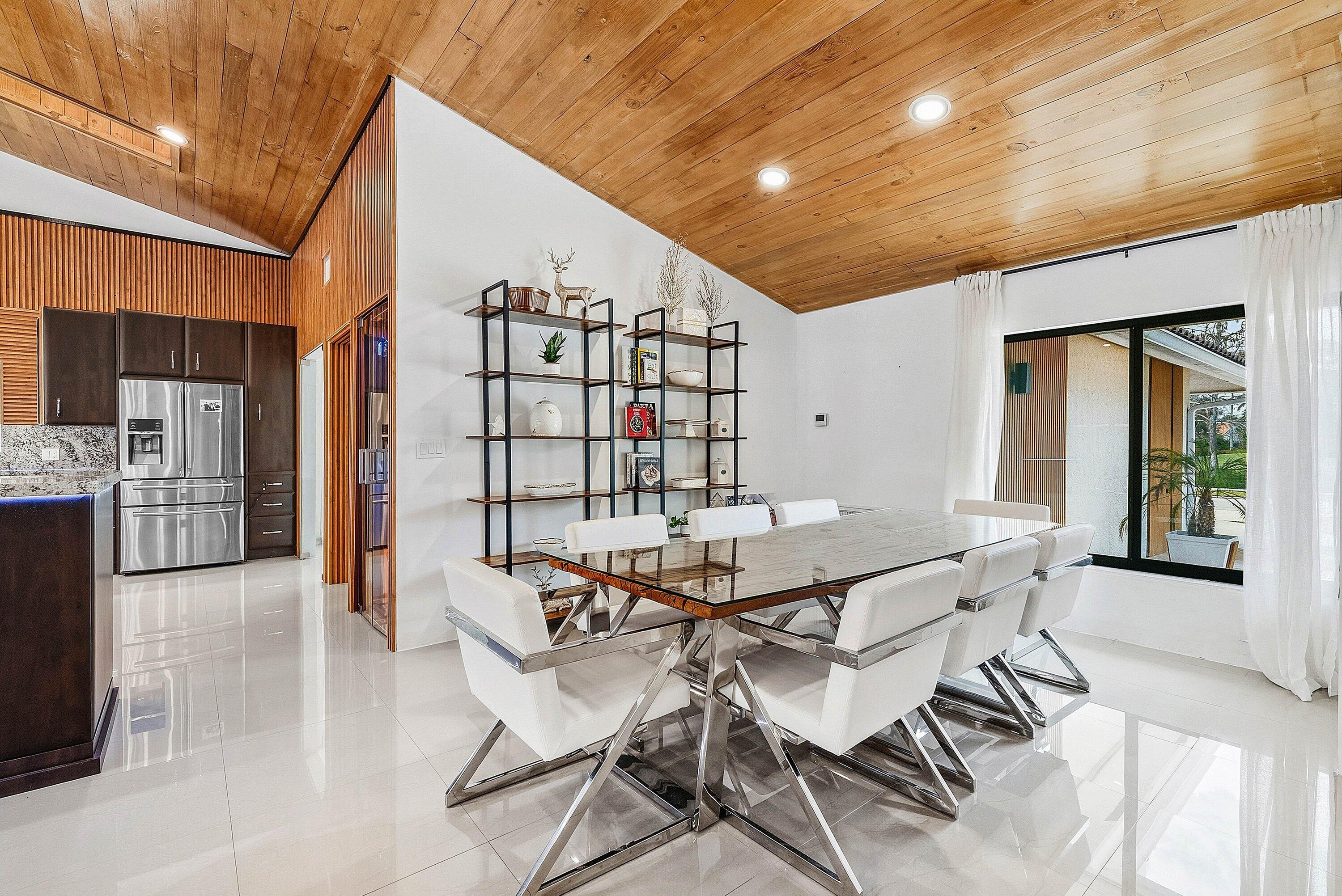 10710 Boca Woods Lane Boca Raton, FL 33428 - Photo 5 of 44 a view of a dining room with furniture and wooden floor