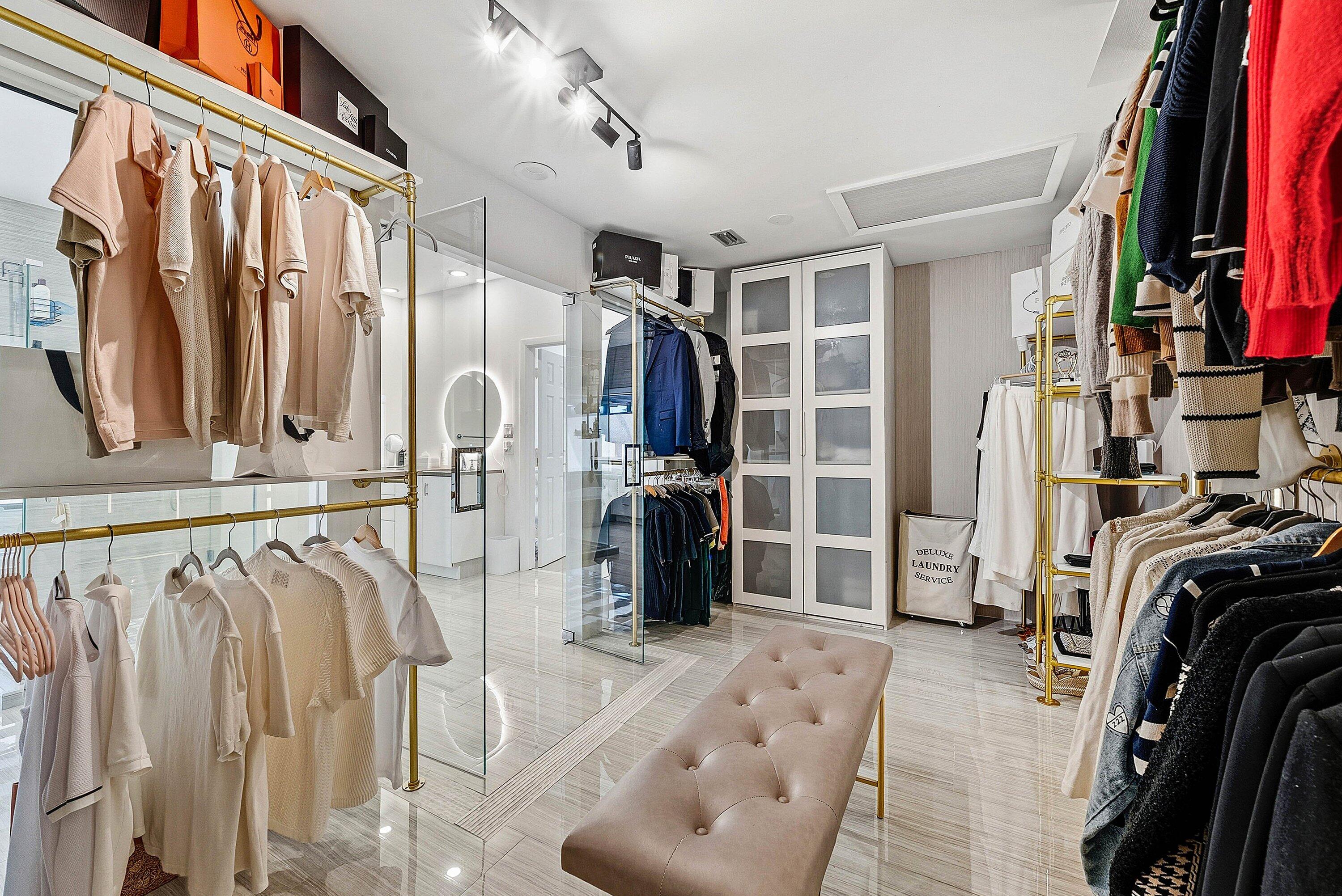 10710 Boca Woods Lane Boca Raton, FL 33428 - Photo 10 of 44 a view of walk in closet with clothes and shoes
