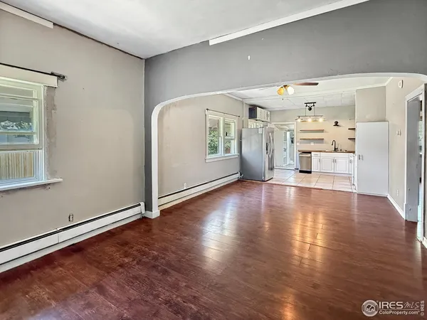 a view of a livingroom with wooden floor