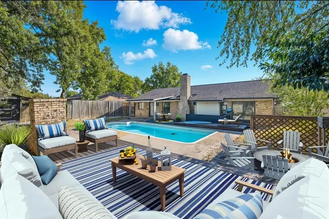 a view of a patio with couches chairs and a fire pit
