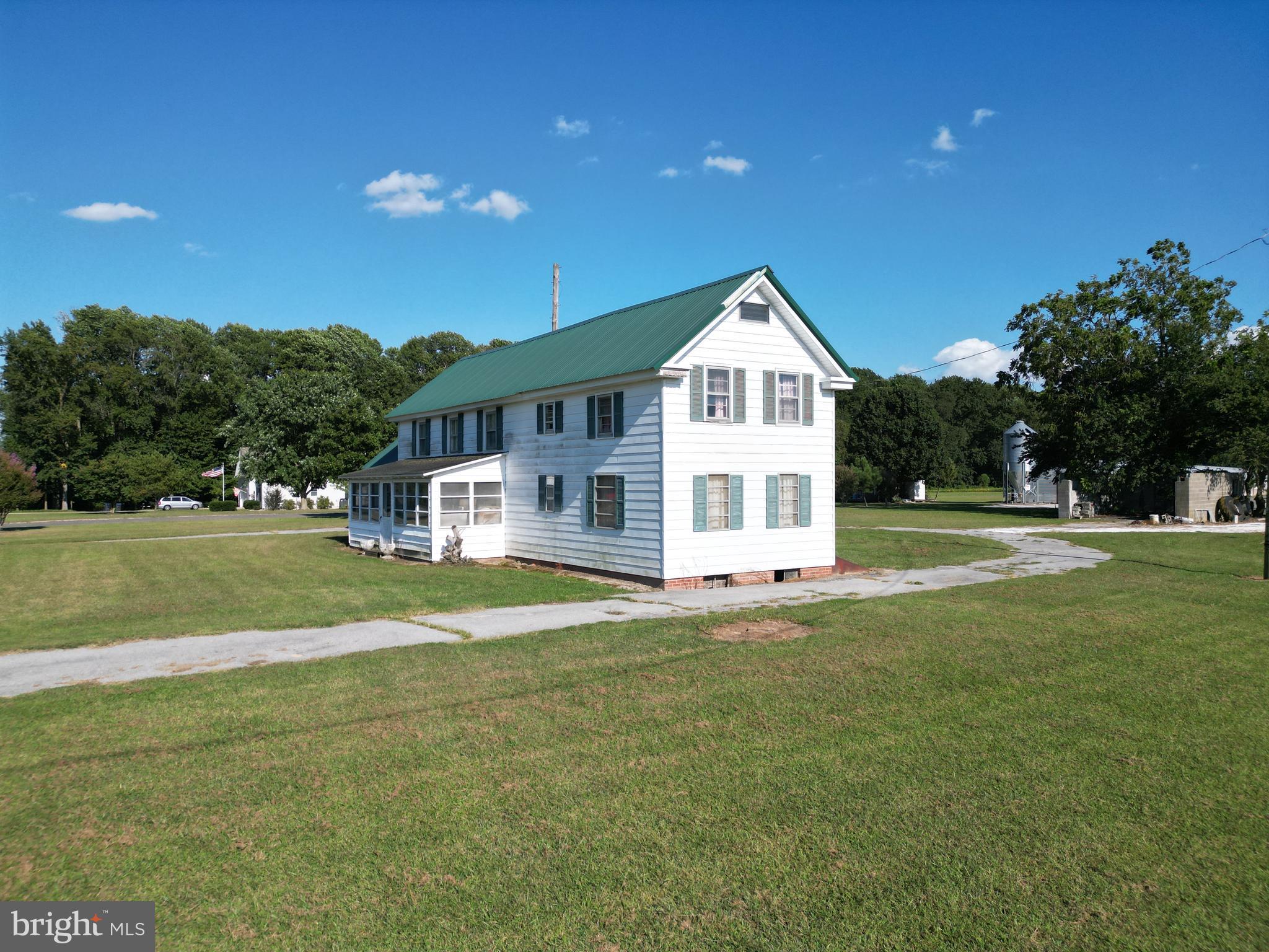 4070 Woodpecker Road Seaford, DE 19973 - Photo 8 of 14 a front view of a house with a yard
