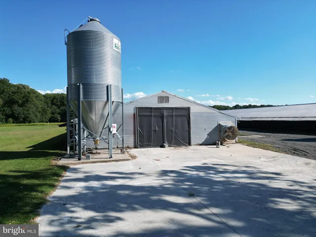 a view of swimming pool with a yard and sitting area