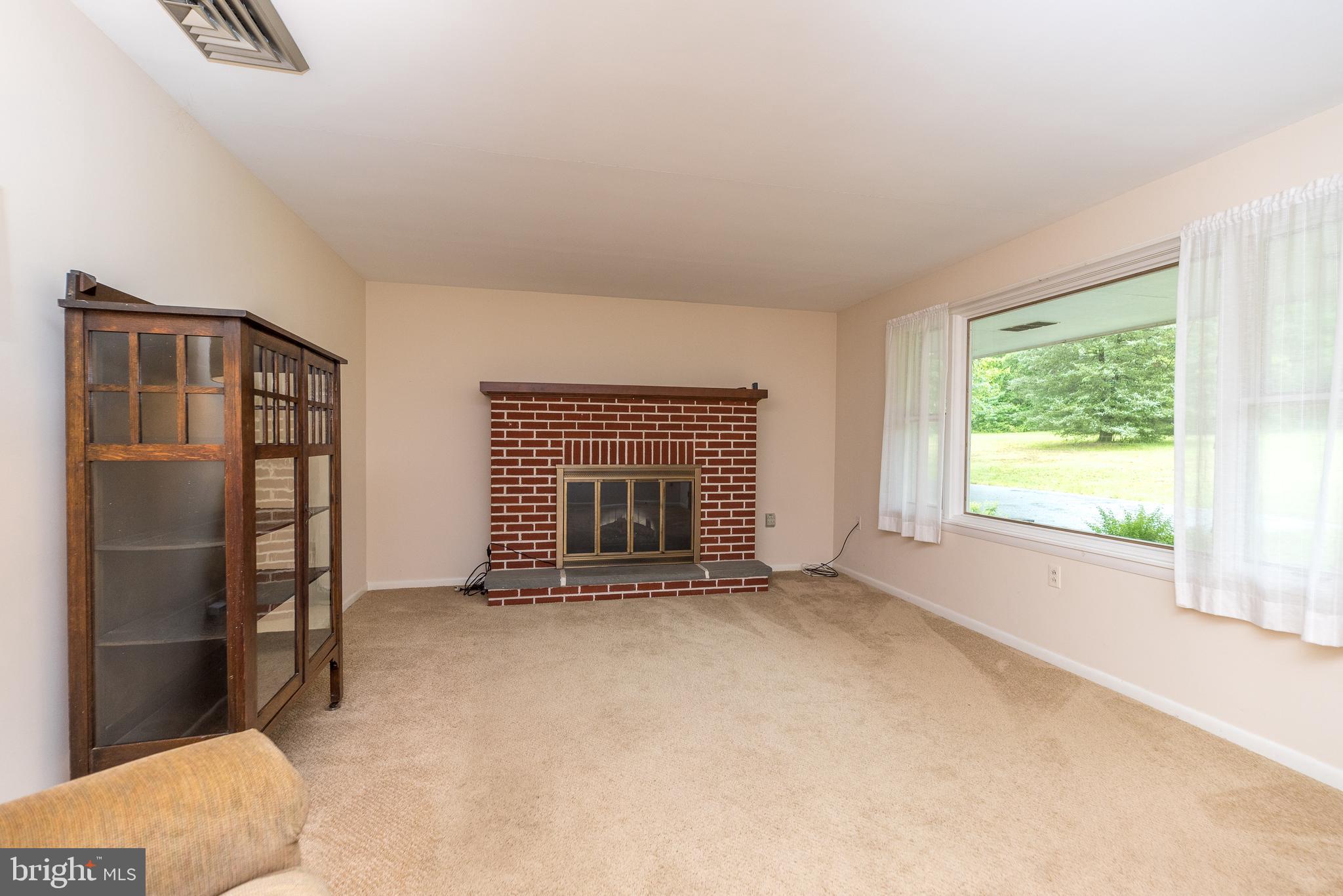84 Dickert Road Quakertown, PA 18951 - Photo 5 of 28 Living Room w/ Brick Fireplace and Picture Window