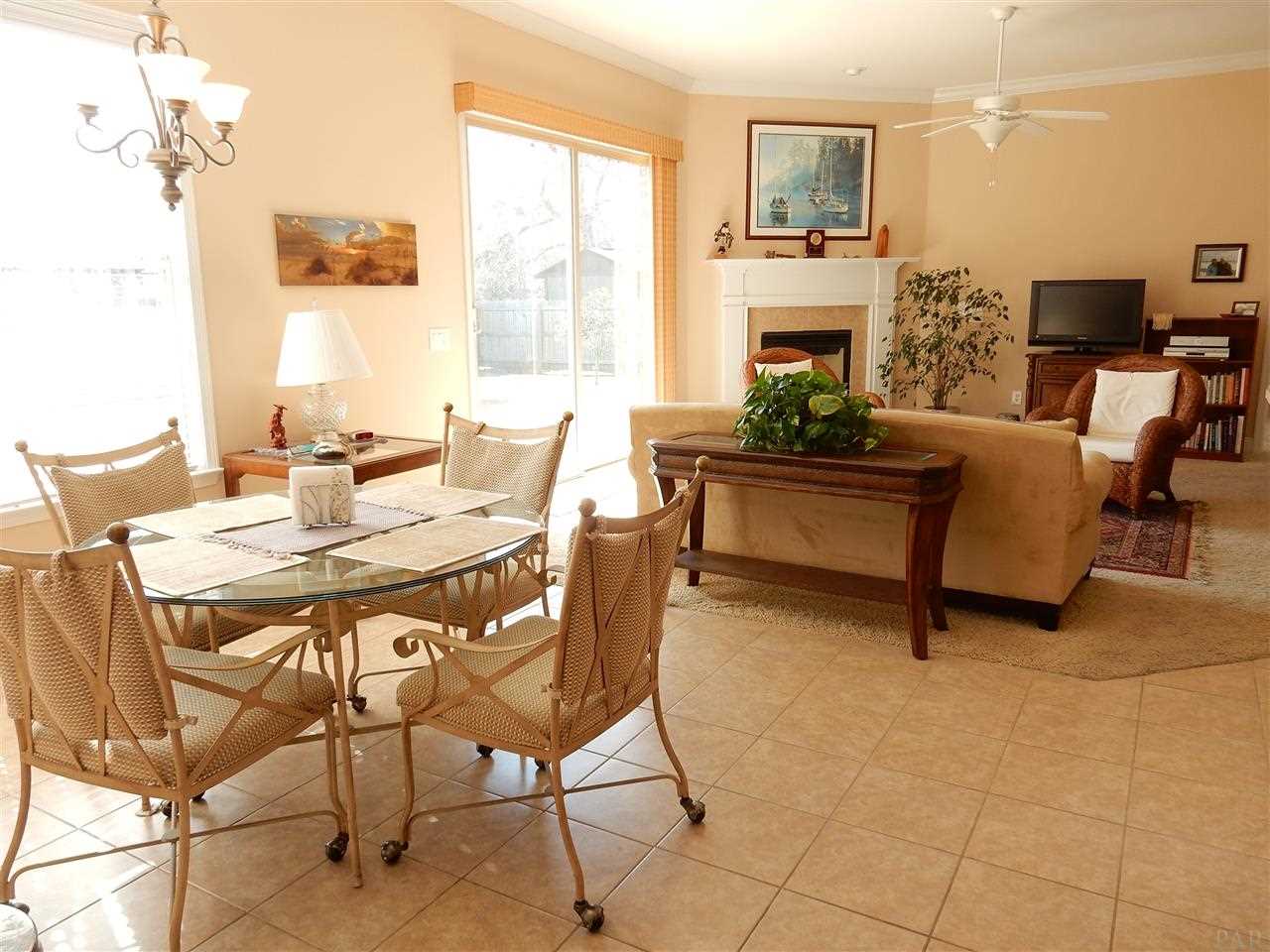 32615 Arbor Ridge Circle Lillian, AL 36549 - Photo 10 of 27 a view of a dining room with furniture window and outside view