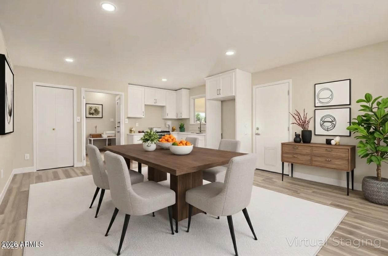 2834 East Shangri-La Road Phoenix, AZ 85028 - Photo 12 of 33 a view of a dining room with furniture and wooden floor