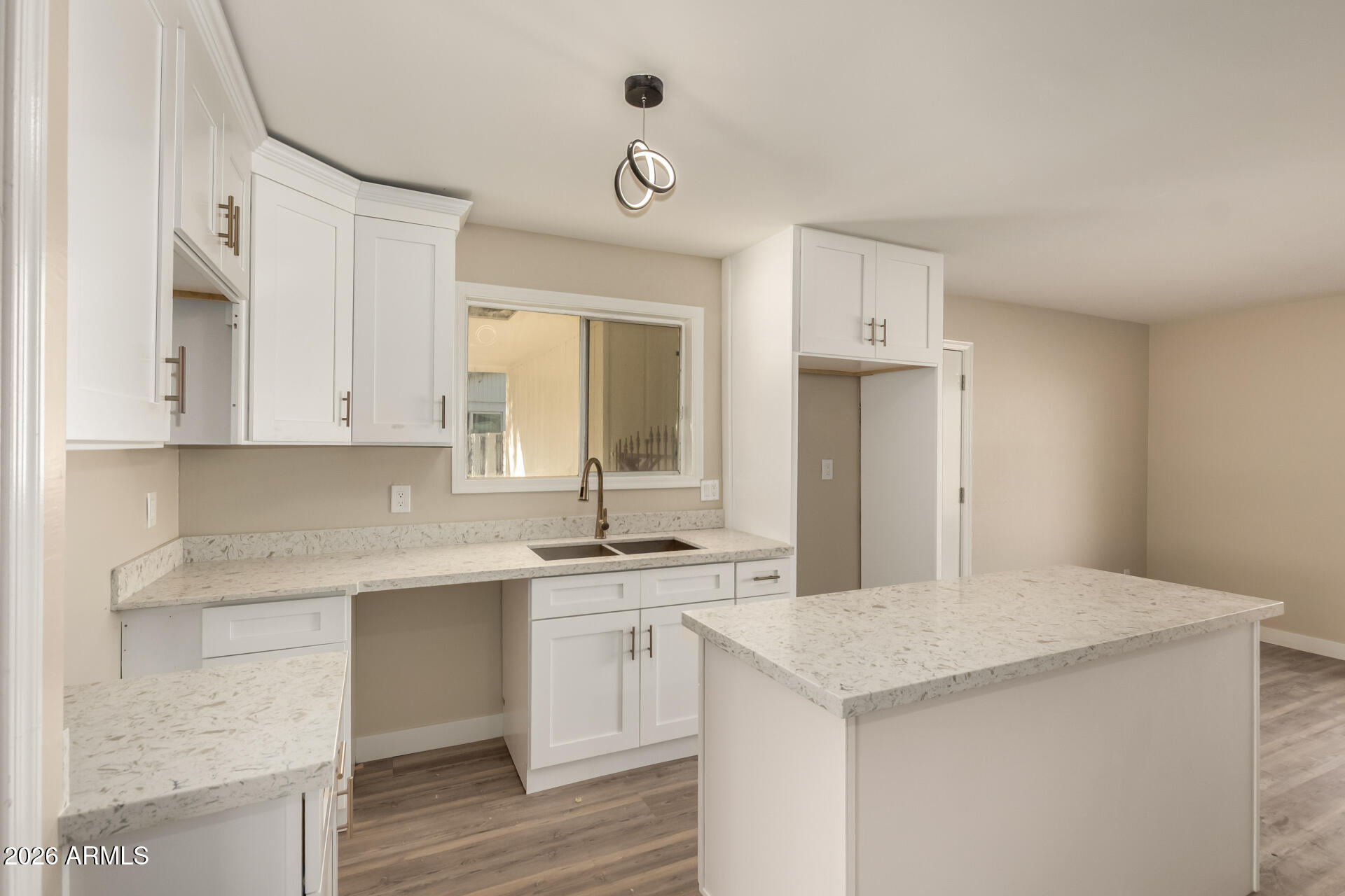 2834 East Shangri-La Road Phoenix, AZ 85028 - Photo 15 of 33 a kitchen with a sink dishwasher and white cabinets with wooden floor