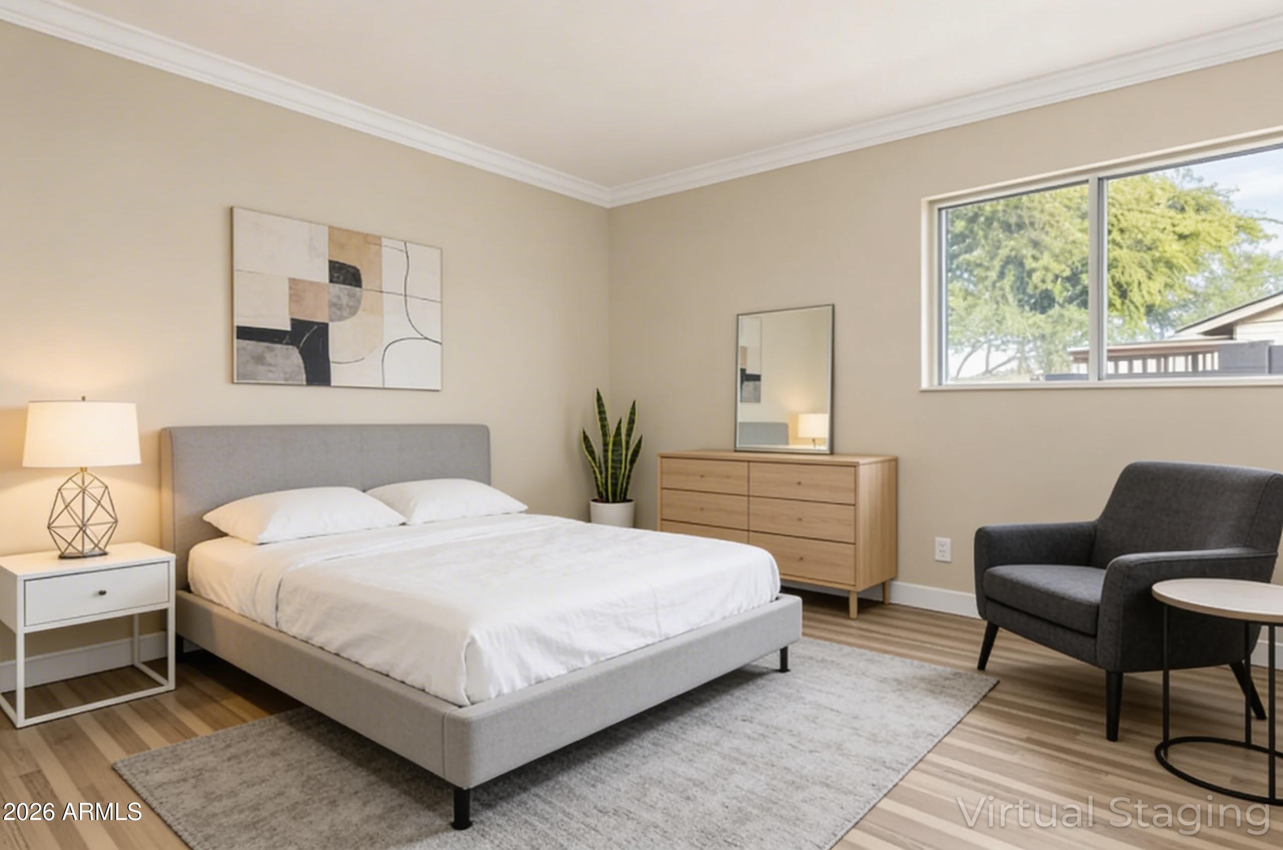 2834 East Shangri-La Road Phoenix, AZ 85028 - Photo 25 of 33 a bedroom with a bed and a chair
