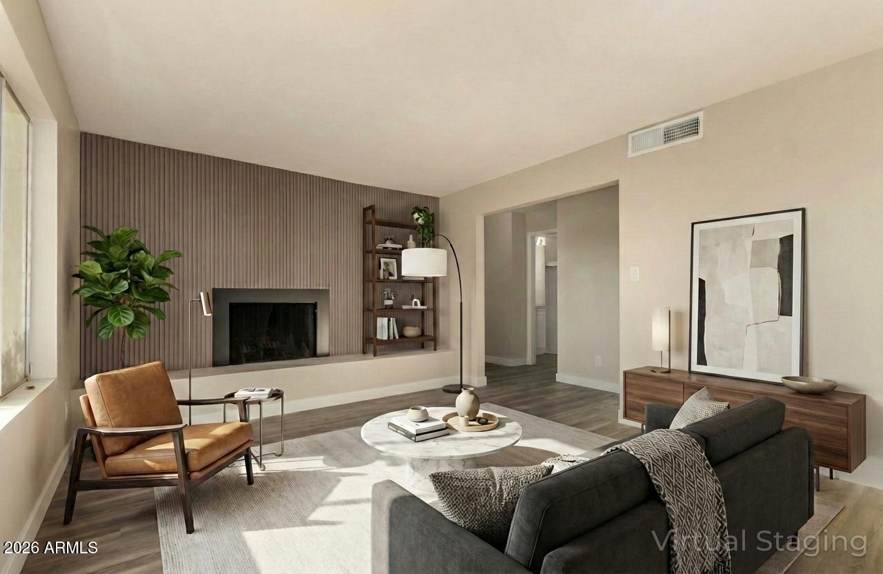 2834 East Shangri-La Road Phoenix, AZ 85028 - Photo 7 of 33 a living room with furniture and a fireplace