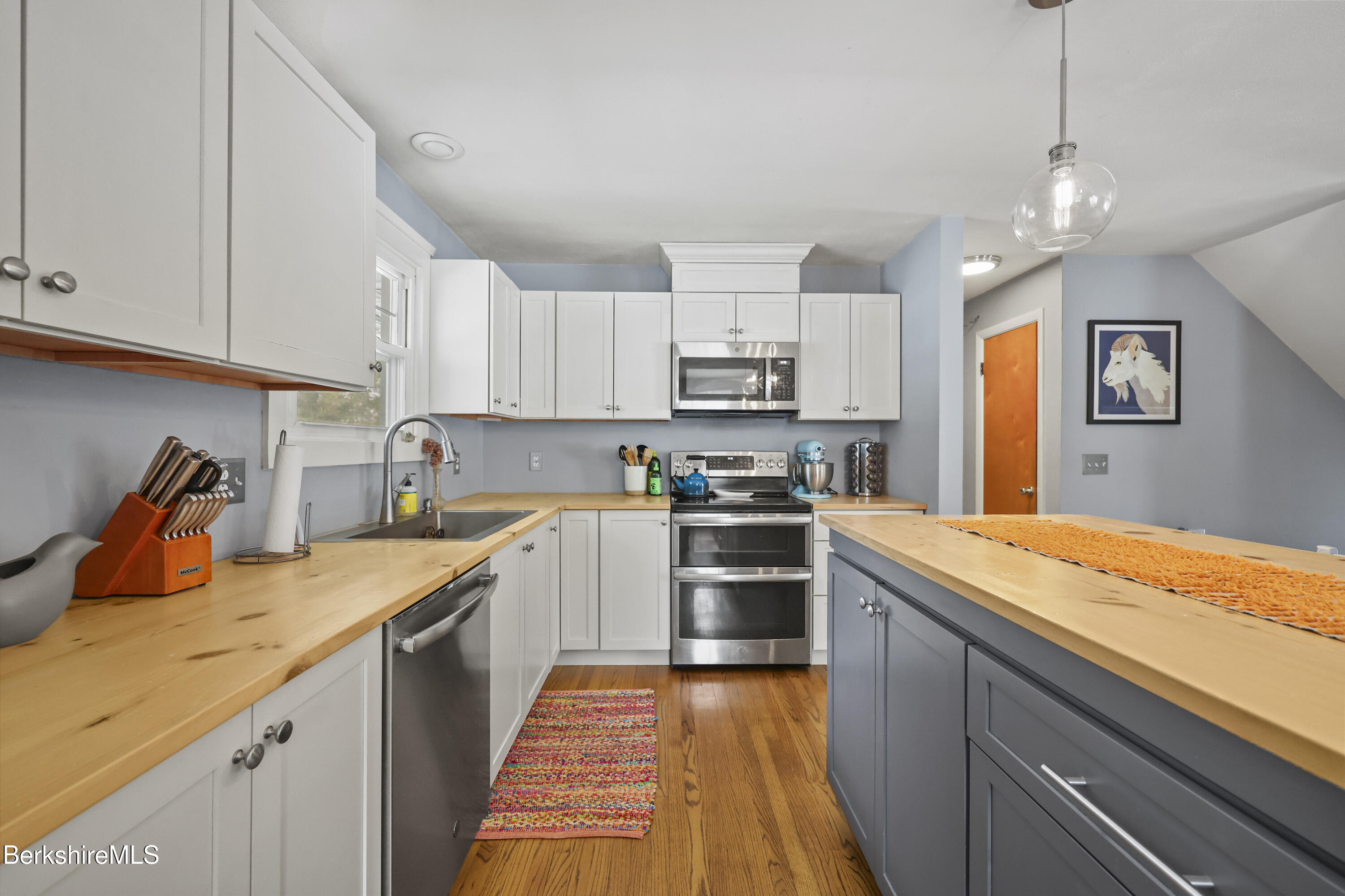 184 Washington Mountain Road Lee, MA 01238 - Photo 16 of 42 a kitchen with stainless steel appliances granite countertop a sink and cabinets