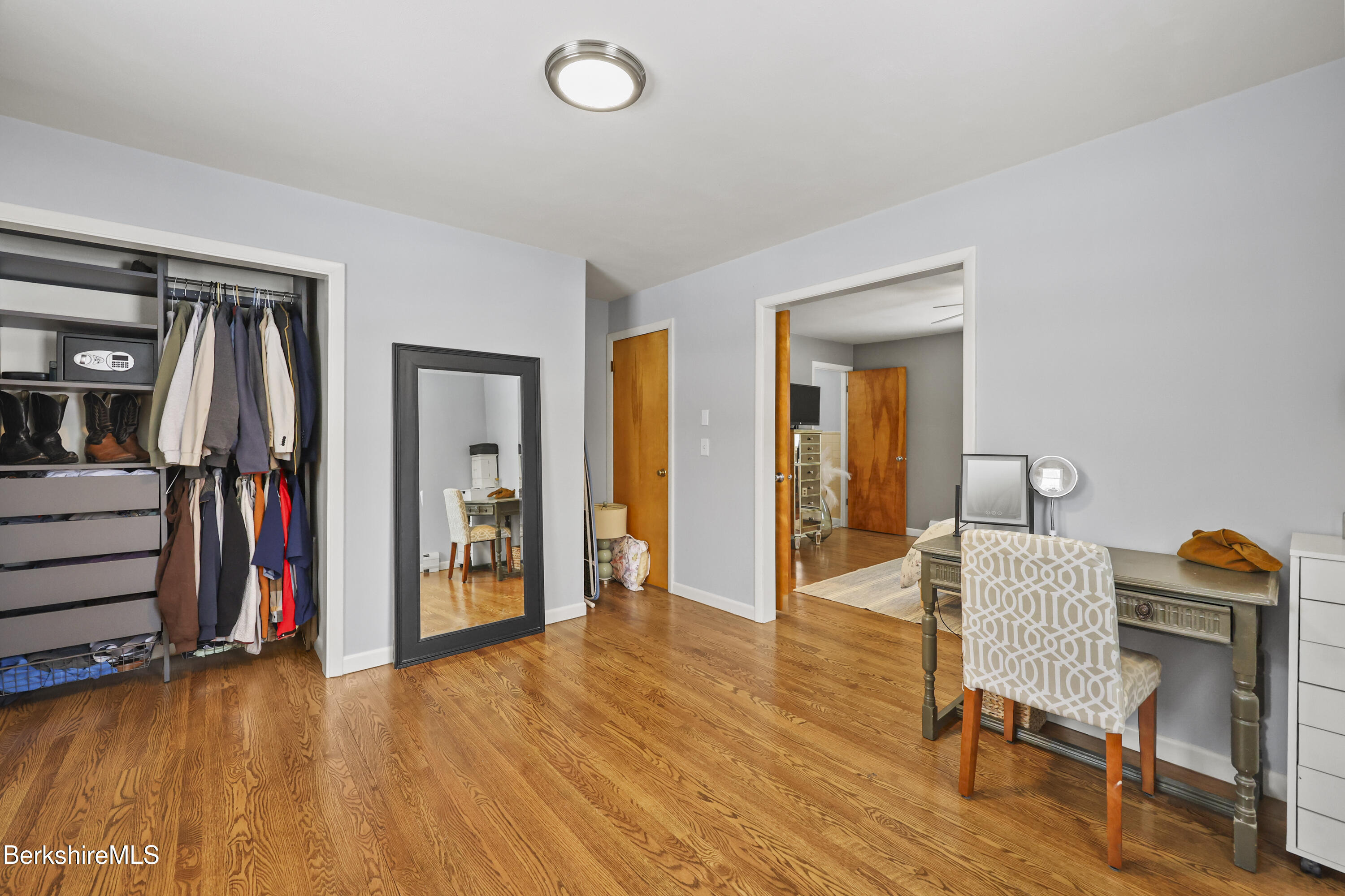 184 Washington Mountain Road Lee, MA 01238 - Photo 28 of 42 a view of a bedroom with furniture and wooden floor
