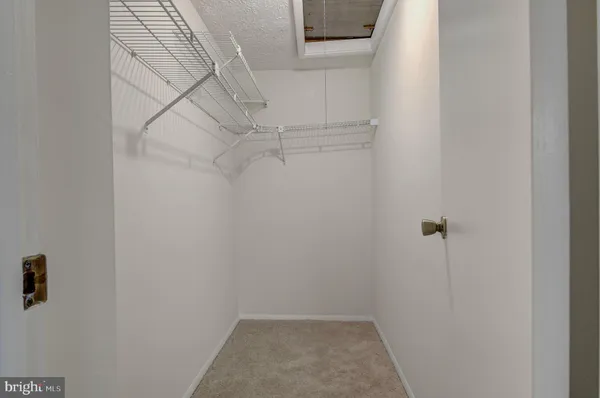 a view of a room with racks on the wall
