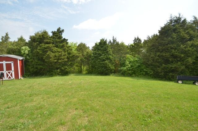 449 Votaw Road Harrodsburg, KY 40330 - Photo 28 of 36 View behind the cottage. Large wooded ar