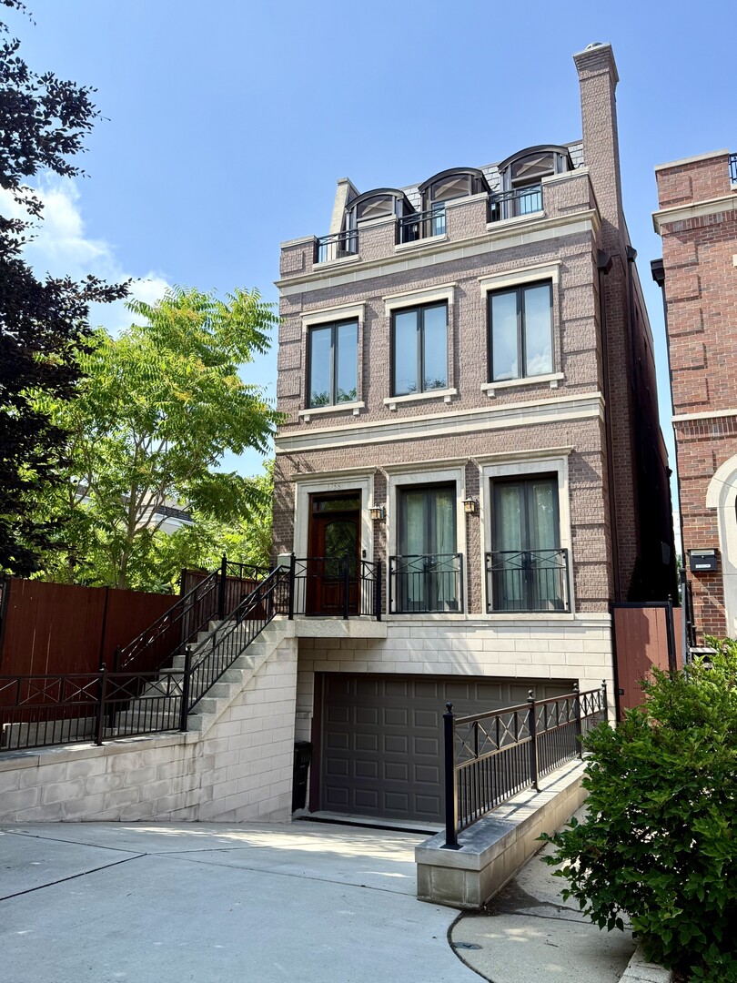 1758 West Surf Street Chicago, IL 60657 - Photo 1 of 51 a view of a building with a balcony