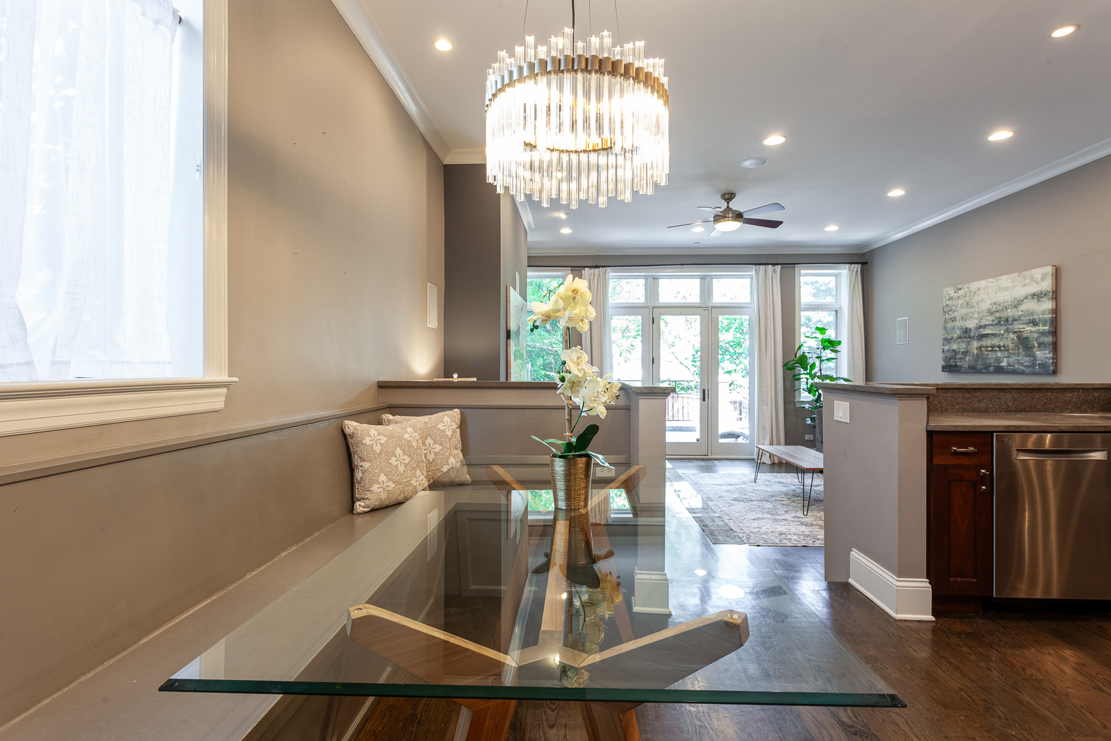 1758 West Surf Street Chicago, IL 60657 - Photo 15 of 51 a view of a dining room with furniture a chandelier and wooden floor