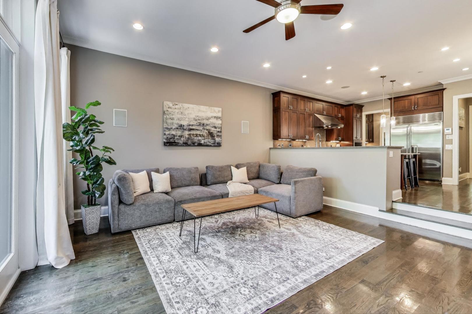 1758 West Surf Street Chicago, IL 60657 - Photo 16 of 51 a living room with furniture and a rug