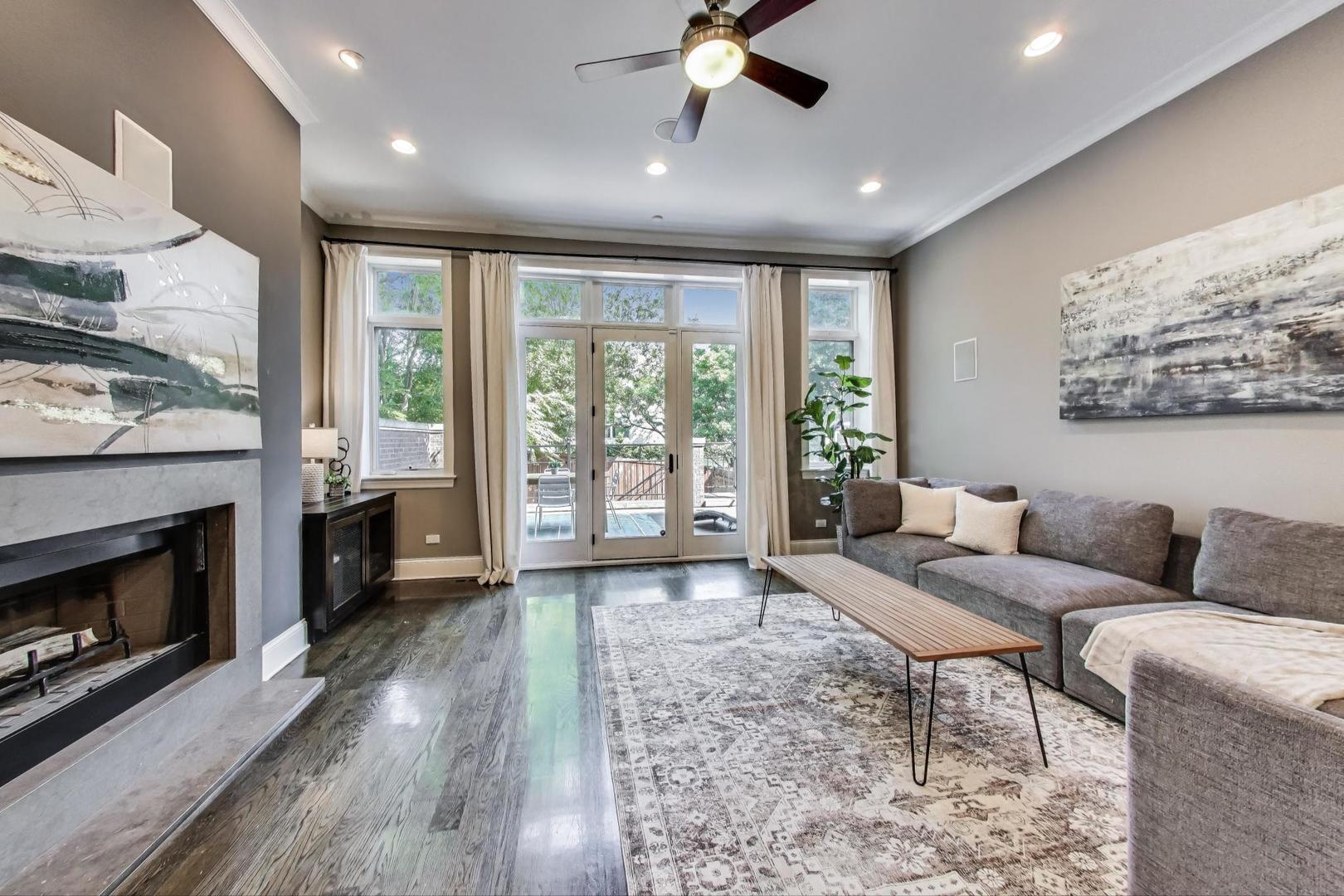 1758 West Surf Street Chicago, IL 60657 - Photo 18 of 51 a living room with furniture and a fireplace