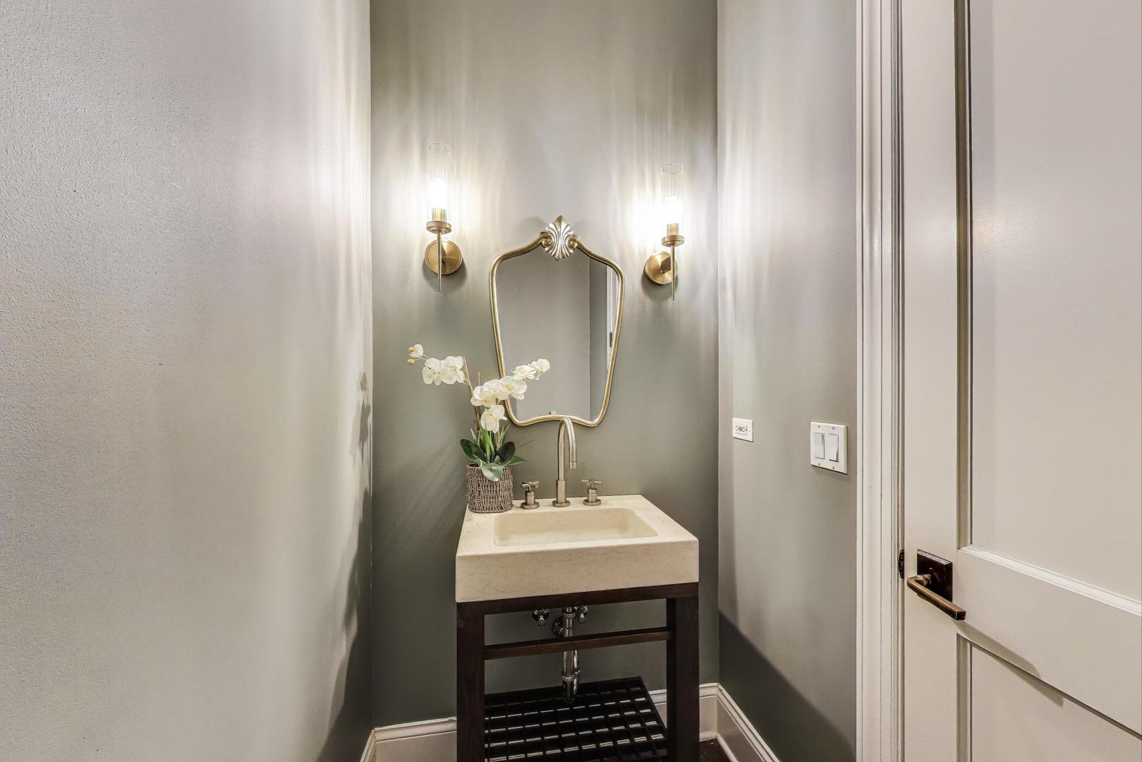 1758 West Surf Street Chicago, IL 60657 - Photo 21 of 51 a bathroom with a sink and a mirror