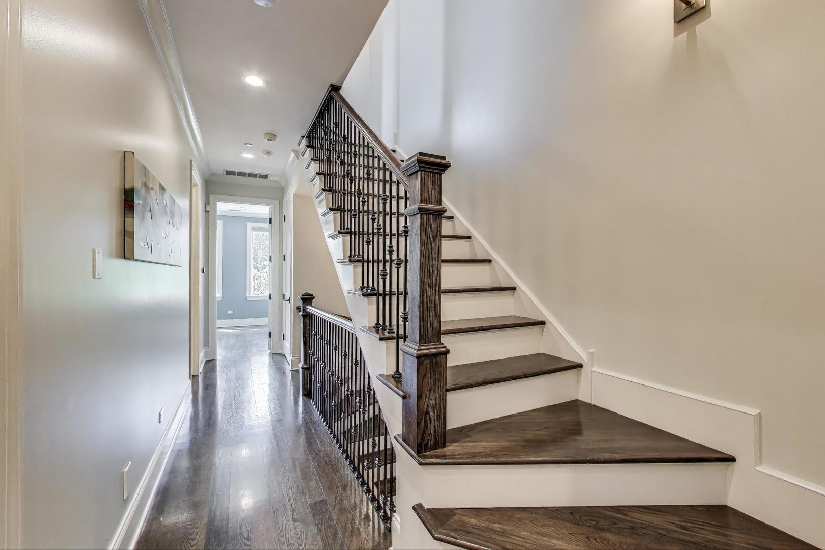 1758 West Surf Street Chicago, IL 60657 - Photo 22 of 51 a view of entryway and hall with wooden floor
