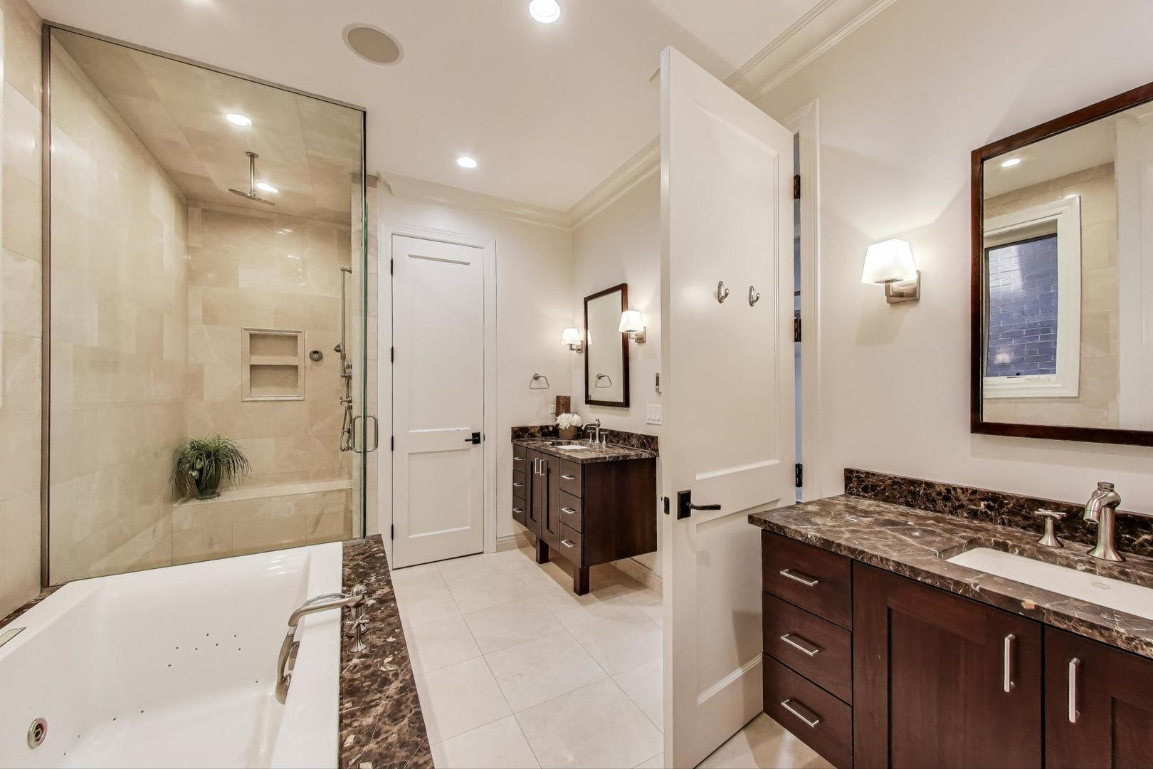 1758 West Surf Street Chicago, IL 60657 - Photo 25 of 51 a bathroom with a tub sink and mirror