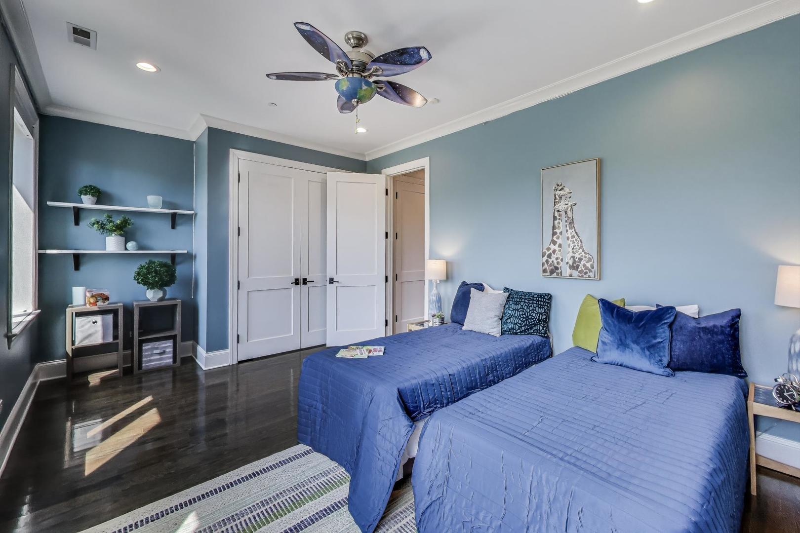 1758 West Surf Street Chicago, IL 60657 - Photo 27 of 51 a bedroom with a bed and a chandelier