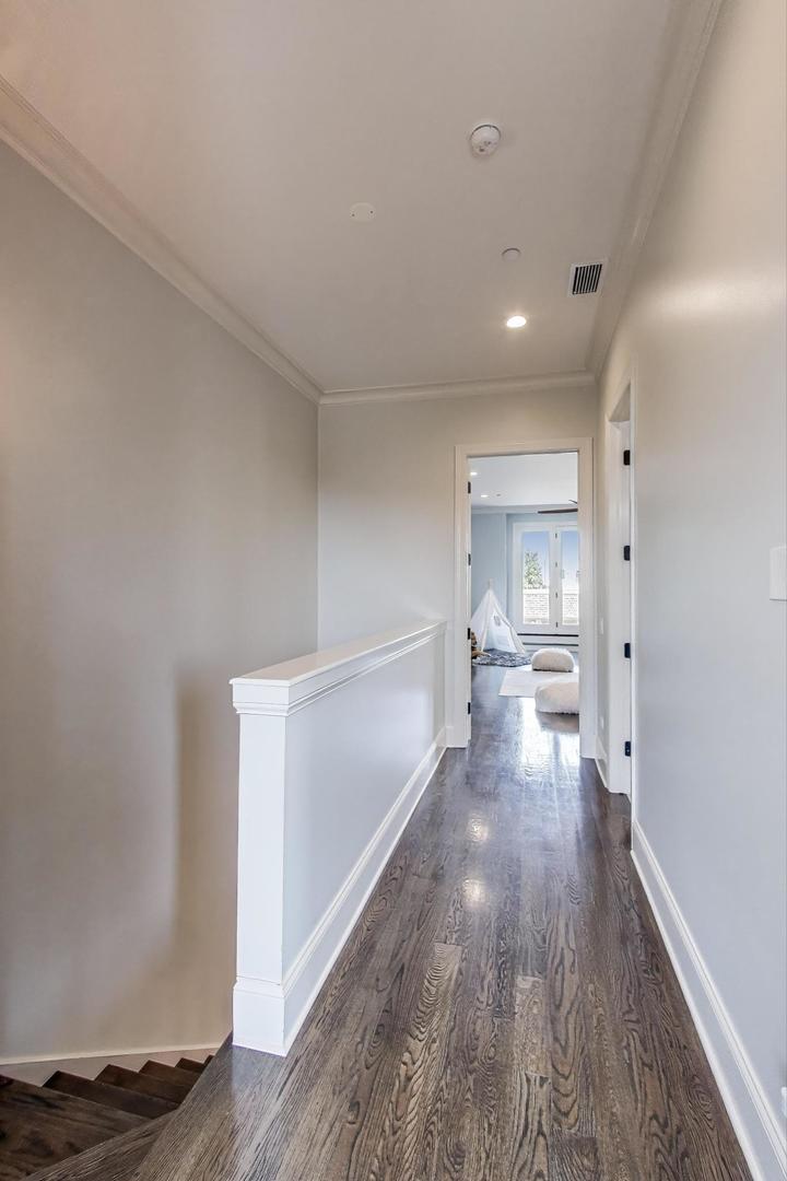 1758 West Surf Street Chicago, IL 60657 - Photo 30 of 51 a view of a room with wooden floor