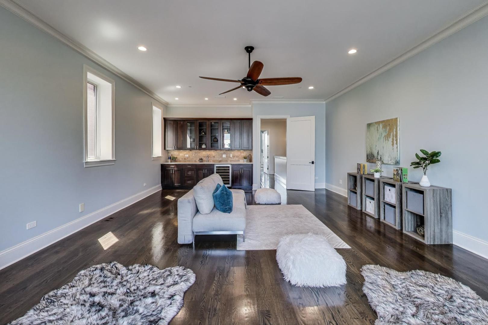 1758 West Surf Street Chicago, IL 60657 - Photo 32 of 51 a living room with furniture and a rug