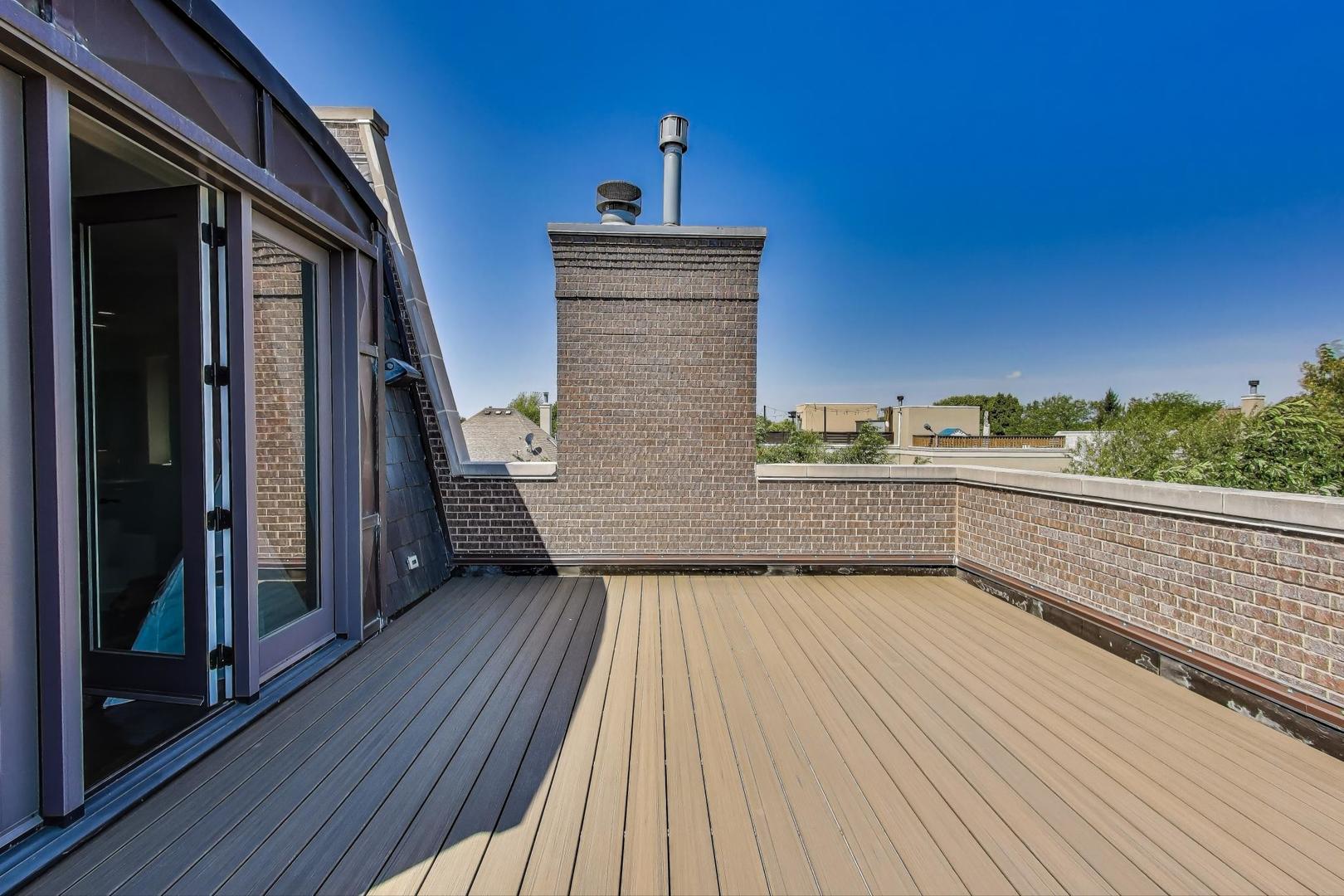 1758 West Surf Street Chicago, IL 60657 - Photo 35 of 51 a view of balcony with wooden floor and seating space