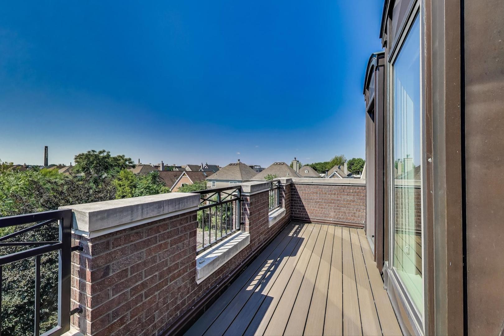 1758 West Surf Street Chicago, IL 60657 - Photo 41 of 51 a view of balcony with furniture