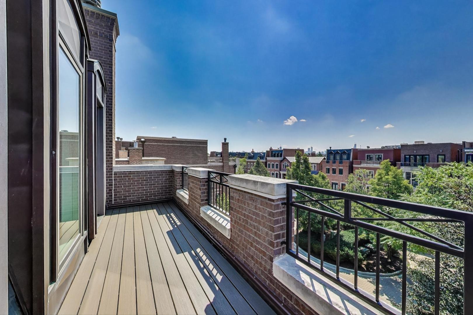 1758 West Surf Street Chicago, IL 60657 - Photo 42 of 51 a view of a balcony with wooden floor