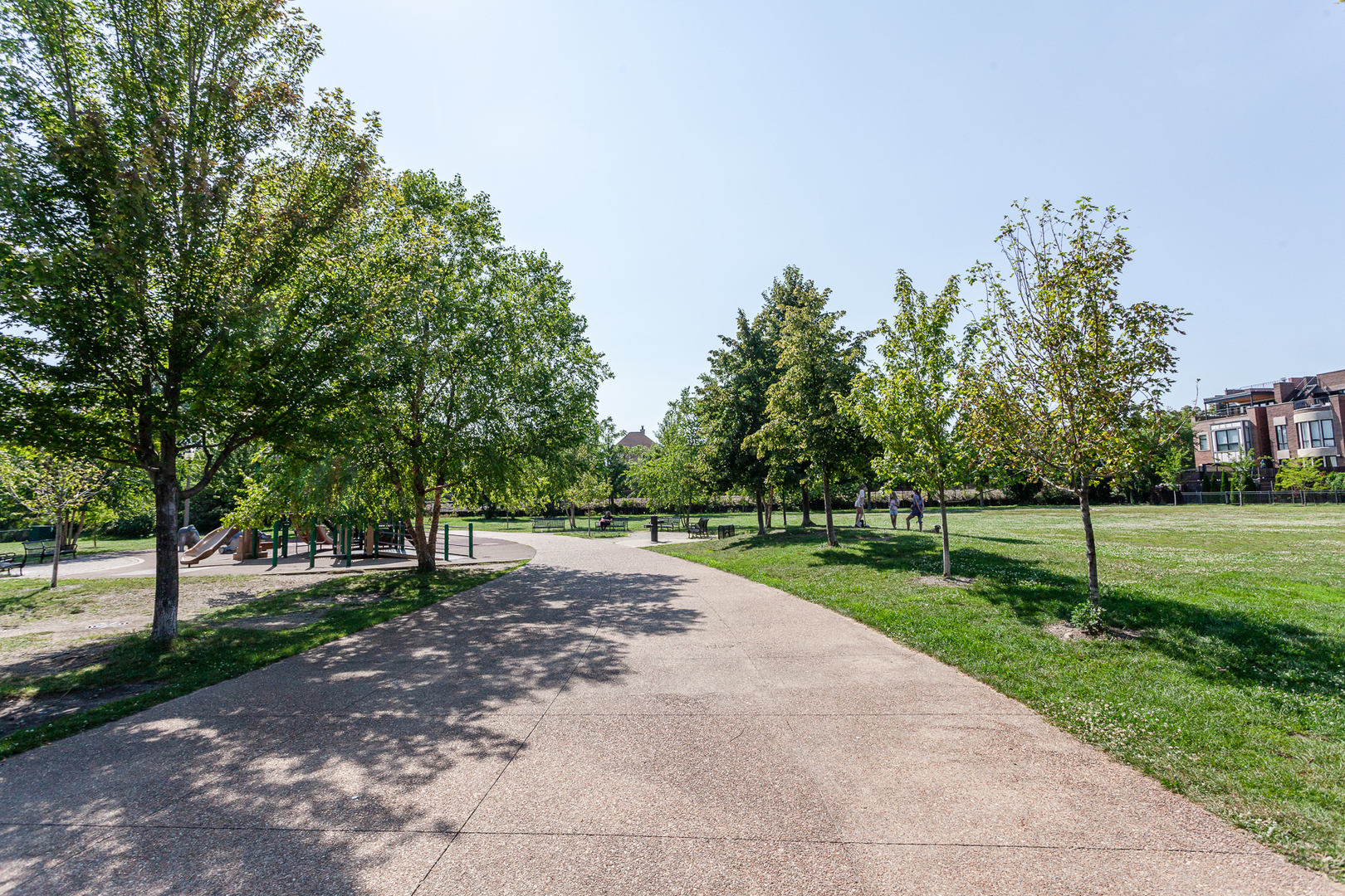1758 West Surf Street Chicago, IL 60657 - Photo 49 of 51 a view of a street with a yard and trees