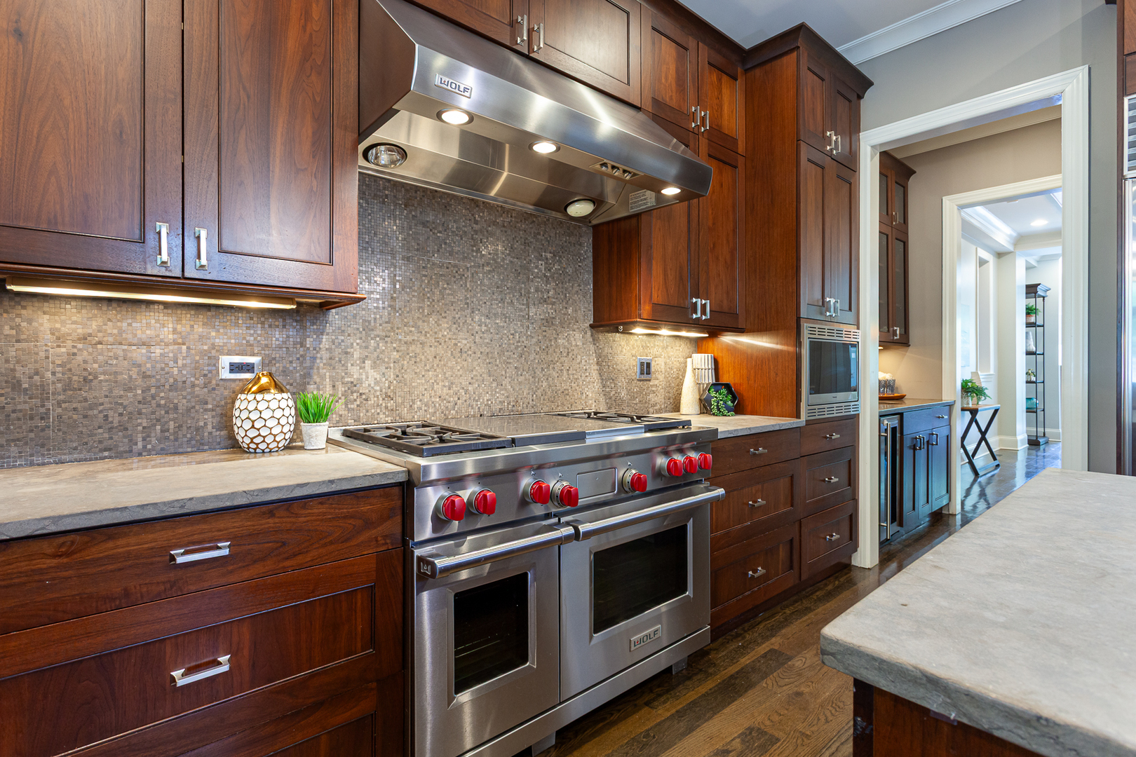 1758 West Surf Street Chicago, IL 60657 - Photo 9 of 51 a kitchen with stainless steel appliances a stove and a microwave