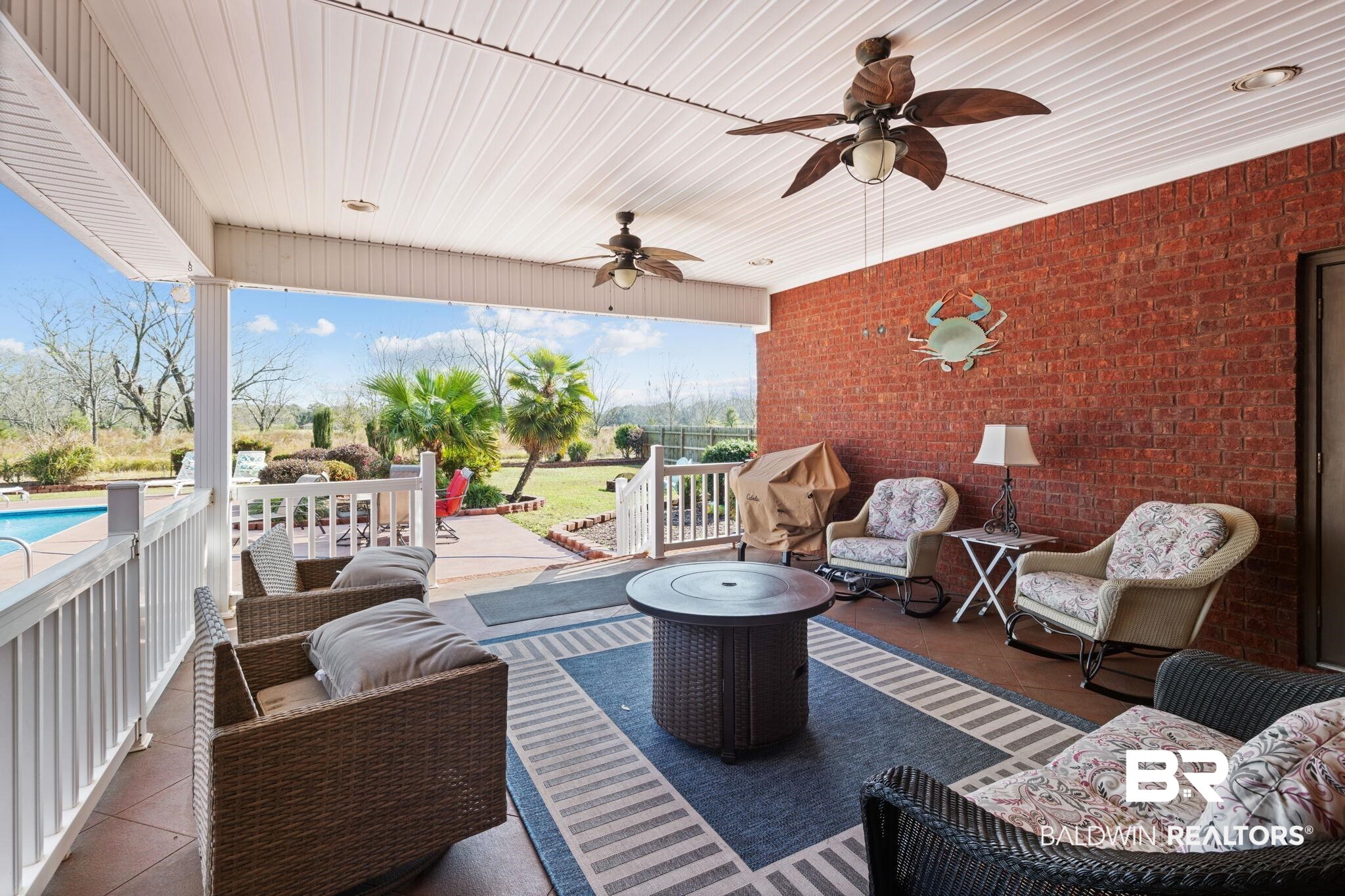 4771 Pecan Ridge East Mobile, AL 36619 - Photo 6 of 48 Wooden deck featuring an outdoor hangout area, ceiling fan, a patio area, and an outdoor pool