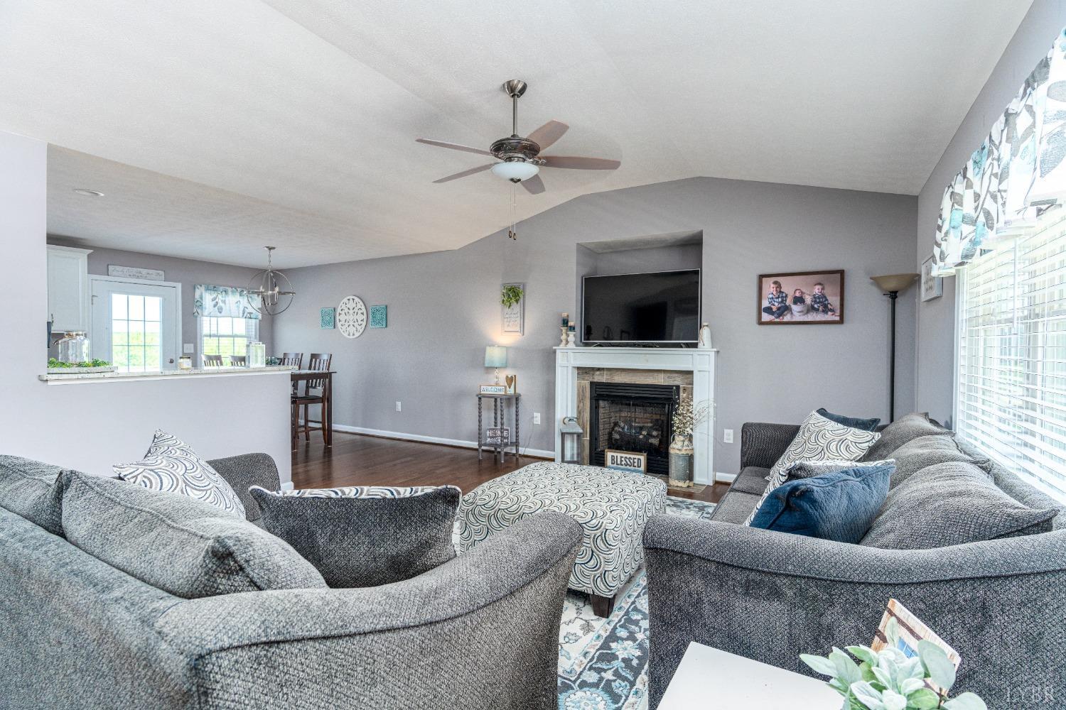 517 Beeks Lane Spout Spring, VA 24593 - Photo 3 of 33 a living room with furniture and a fireplace
