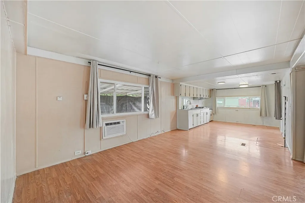 8787 Locust, Unit 24 Fontana, CA 92335 - Photo 15 of 27 a big room with wooden floor and natural light