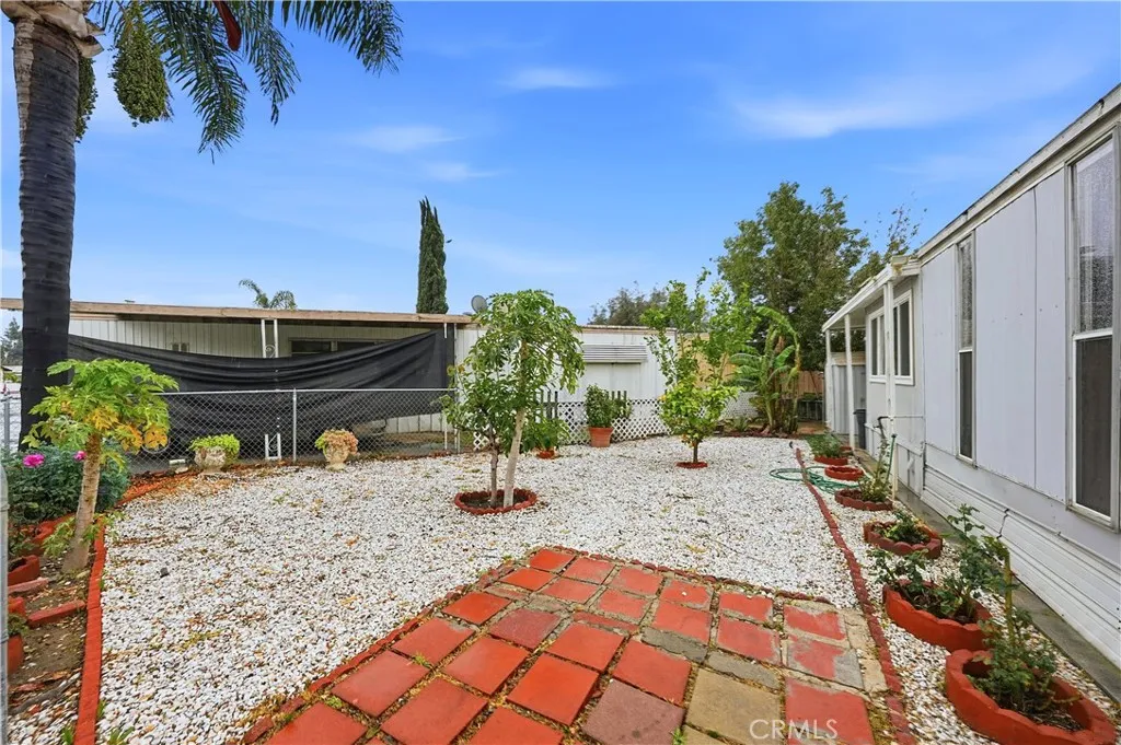 8787 Locust, Unit 24 Fontana, CA 92335 - Photo 2 of 27 a view of a backyard with sitting area