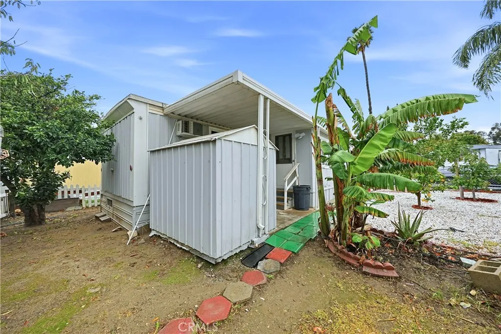 8787 Locust, Unit 24 Fontana, CA 92335 - Photo 5 of 27 front view of a house with a yard