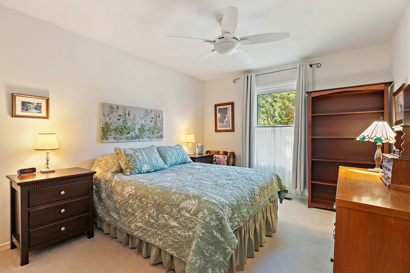 1410 Nottingham Lane Hoffman Estates, IL 60169 - Photo 16 of 29 a bedroom with a bed and a dresser