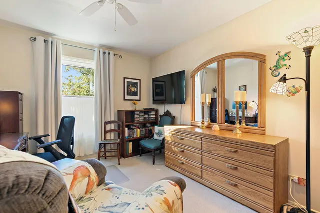 a bedroom with a bed and dresser