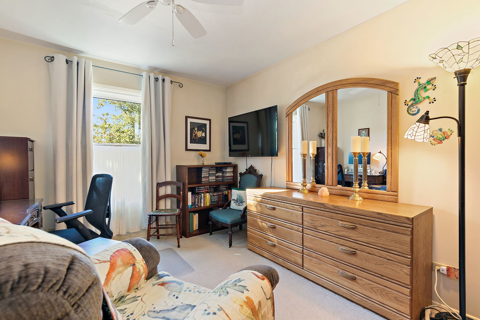 1410 Nottingham Lane Hoffman Estates, IL 60169 - Photo 18 of 29 a bedroom with bed and a flat tv screen on dresser