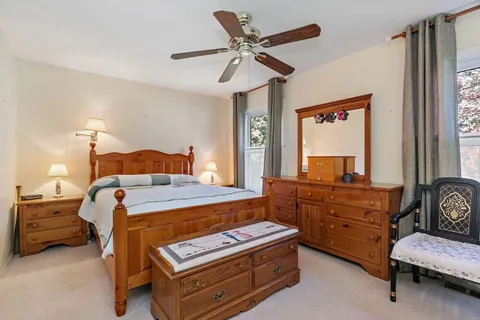 a bedroom with a bed and furniture