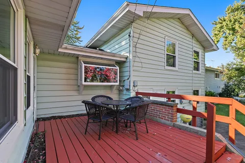 a view of a house with backyard porch and sitting area