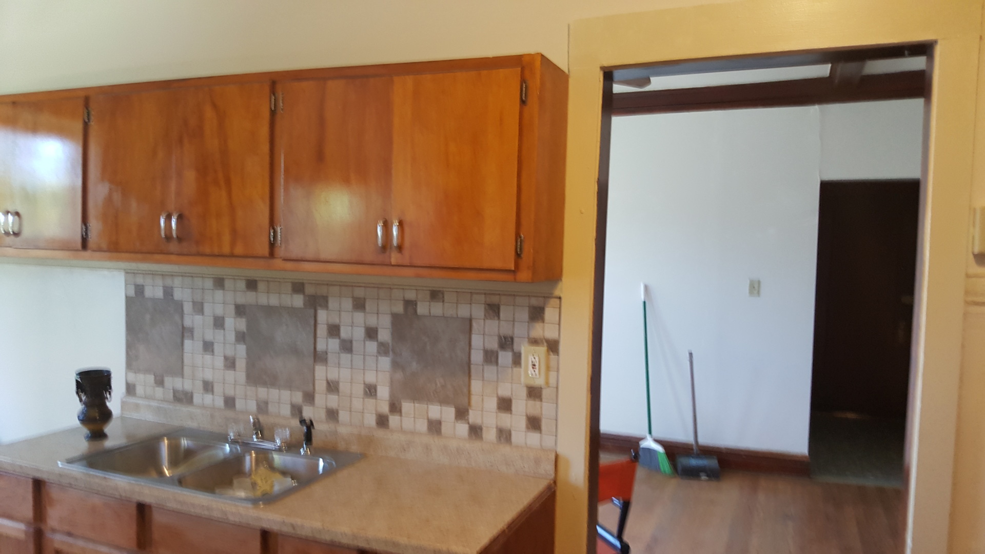 6844 South Normal Boulevard Chicago, IL 60621 - Photo 15 of 18 a bathroom with a sink and a mirror