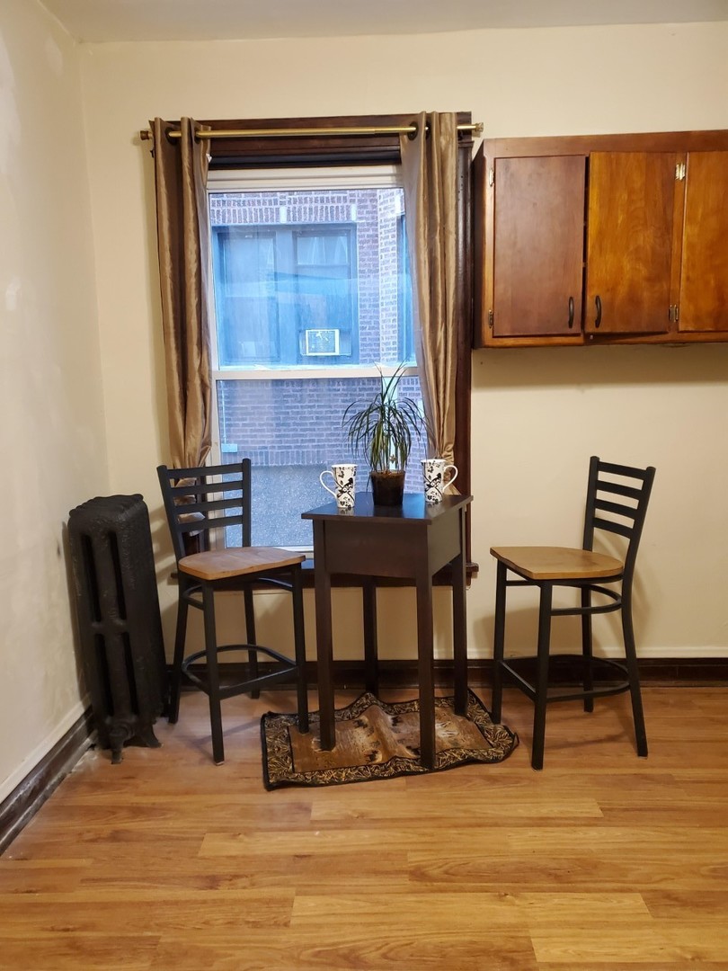 6844 South Normal Boulevard Chicago, IL 60621 - Photo 8 of 18 a view of a dining room with furniture