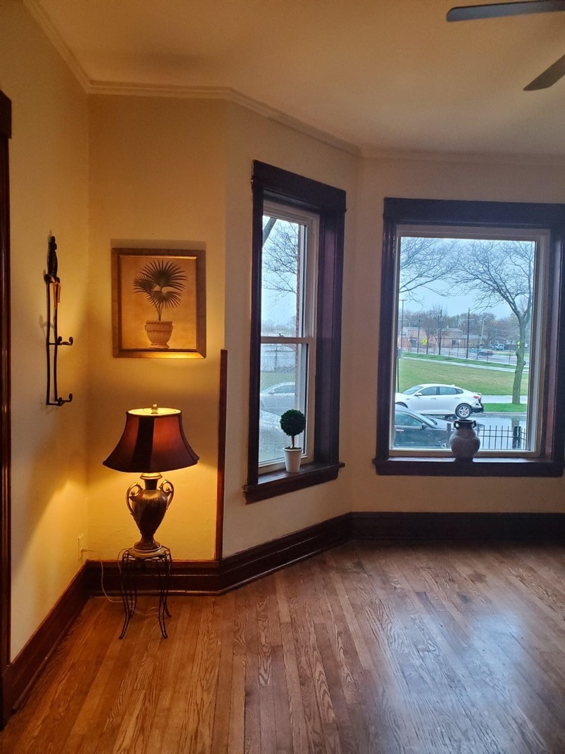 6844 South Normal Boulevard Chicago, IL 60621 - Photo 9 of 18 a living room with furniture and a window