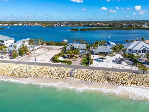 an aerial view of a house with a ocean view