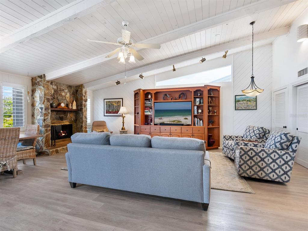 3240 Casey Key Road Nokomis, FL 34275 - Photo 12 of 51 a living room with furniture and a flat screen tv
