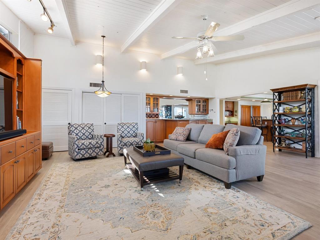 3240 Casey Key Road Nokomis, FL 34275 - Photo 13 of 51 a living room with furniture and wooden floor